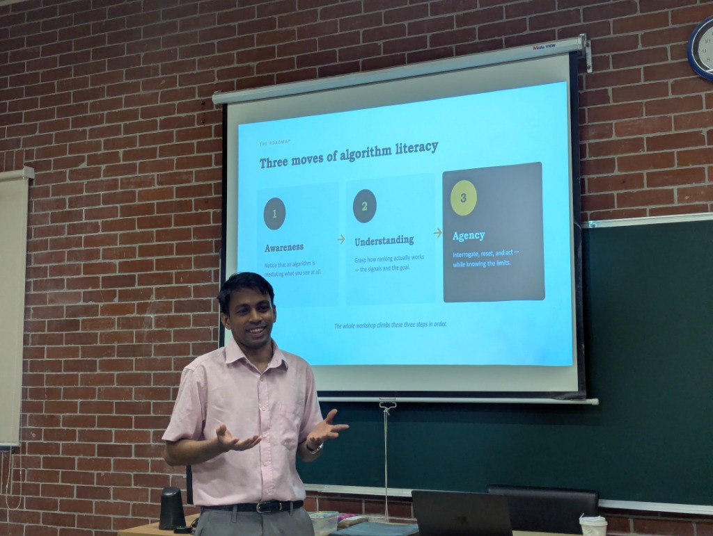 Miraz explaining the three moves of algorithm literacy during the workshop