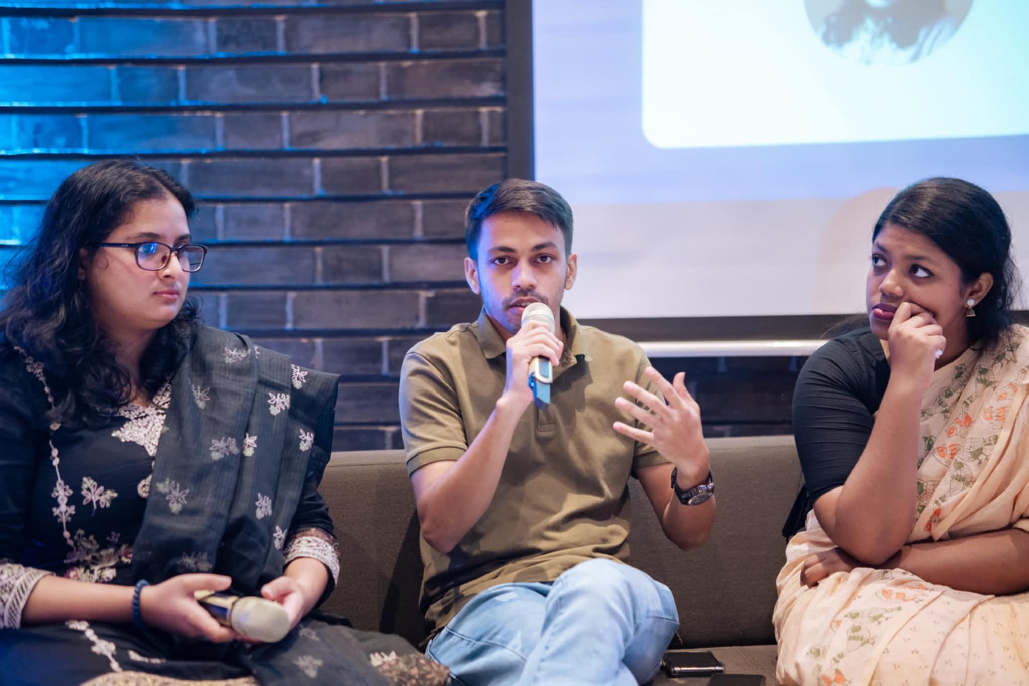 Miraz speaking at a media literacy panel at the German Embassy Dhaka with two fellow panelists